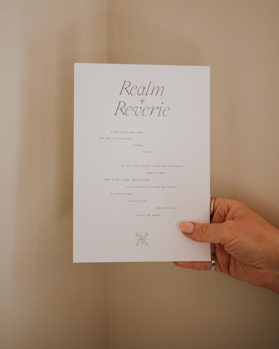 person holding realm of reverie by Cerita minimal paper art print against neutral background