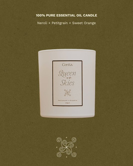 queen of the skies aromatherapy candle by Cerita on green background with fragrance notes text