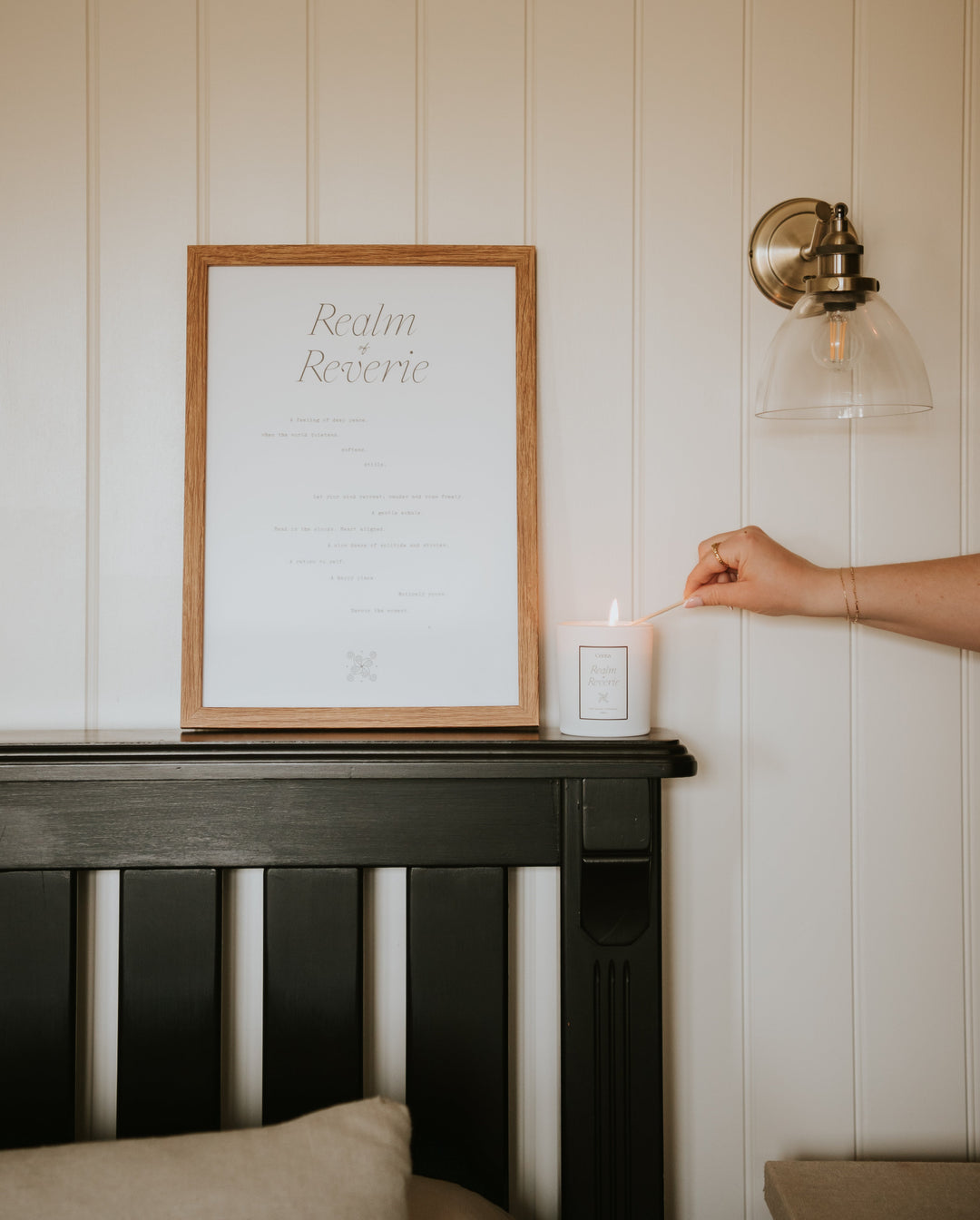 framed realm of reverie typography art print and aromatherapy candle by Cerita on wooden bedroom shelf