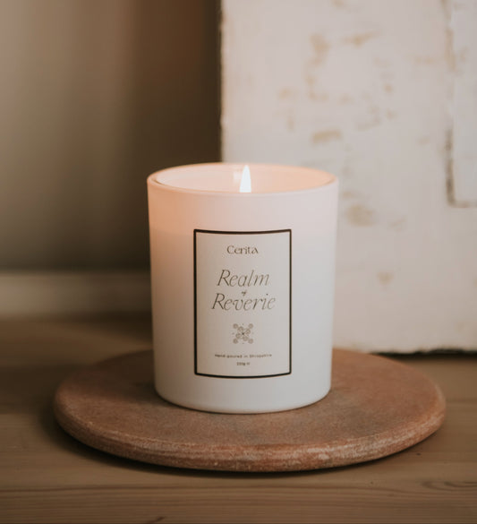 realm of reverie essential oil candle by Cerita on pink marble board